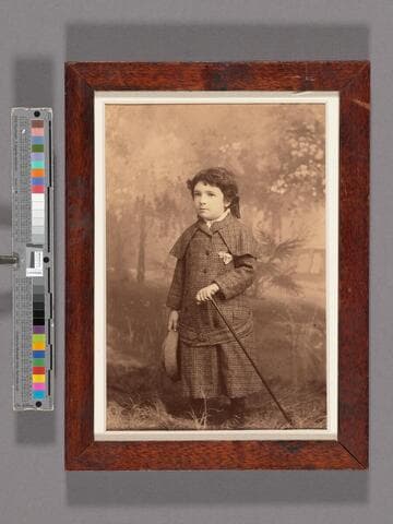 Donald McMeal Shorb as a little boy, in tweed suit, holding cane and hat