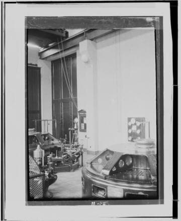 The interior of City of Los Angeles # ? Hydro Plant near Saugus. showing a sign near the door with safety bulletins and two low-