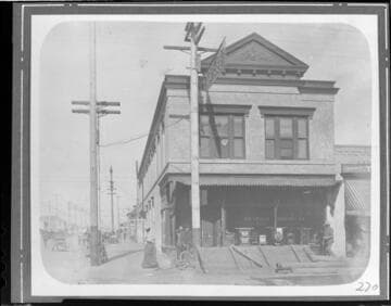 A woman and three men standing in front of the Long Beach Local Office