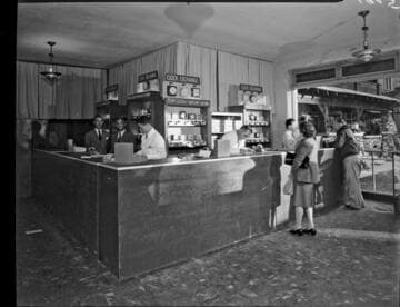 Customers exchanging old clocks for new ones during the frequency change