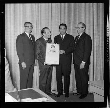 Howard P. Allen receiving awards of recognition from the City and County of Los Angeles