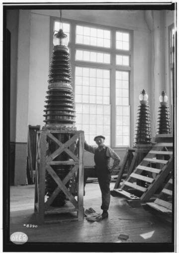 Man standing by new 220kV bushing