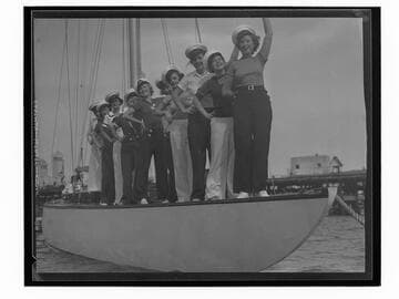 Young women on a boat at the Yacht Harbor Breakwater dedication, Santa Monica