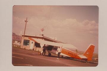 Ron Smith's plane at Kanab Airport. Art Gallenson at left; John Hoffman at right