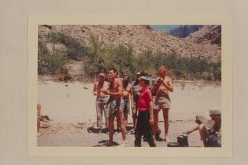 Garth Marston sings a verse of the Disney story by the non-Disney crew.  Mile 205.  Jeff is in the red shirt.  Rod Sanderson; Larry Sanderson; Bob Malott at the read