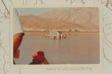 Members of the party of Grand Canyon Expeditions free Jim Jordan's houseboat from sand bar a mile above Gods Pocket