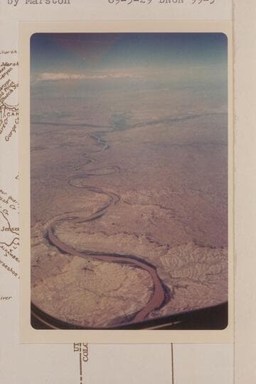 Up Green River from Mile 99 in Desolation Canyon.  The greenery at left and right in the distance marks the Duchesne and White Rivers
