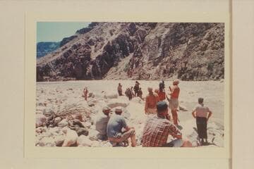 The Powell crew being photographed at Mile 205 Rapid.Jim Algar directs from left.Russ haverick is to left of camera.Dick Kelley operates the camera under direction of Gordon Avil.Doc Reed stands at right