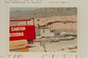 The Grand Canyon Expeditions deflates its baloneys and loads the truck at South Cove. Jim Jordan's houseboat is center