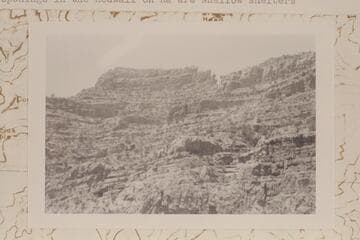 Tower of Ra from upper Redwall summit block looking southwest from point above Redwall climb. The openings in the Redwall on Ra are shallow shelters