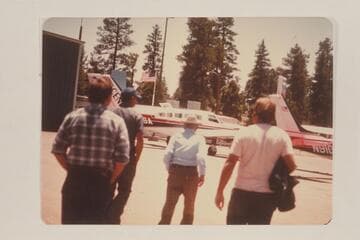 Emery Kolb walks awau from the plane at Grand Canyon after having cruised up to Marble Canyon on a course down in the river gorge