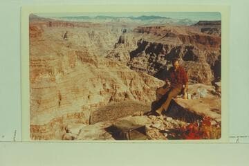Uinkaret Mountains from south rim of Spring Canyon. Jorgen Visbak samples lunch