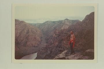 Jorgen Visbak on cliff at Mile 66.7 right bank, in Desolation Canyon