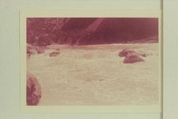 Upper Disaster Rapid. Bill Davis has dropped over the top along the right bank. Mildred Davis is following