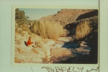 Butchart at breakfast at spring at top of Redwall in Granite Park Canyon