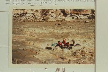 George Stewart's 10-man in the hole in Coal Creek Rapid and 10-15 ft. to right of course.Stewart, who is third from left, reported feeling the impact with a rock on the right beam.Rusho later ran the correct course with smaller flotation and no difficult