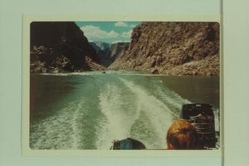 Down river to head of rapid at Mile 231.9 showing outboard powered Zodiac boats climbing up river