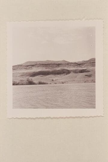 Wheels on the bank opposite the Hoskanini Dredge