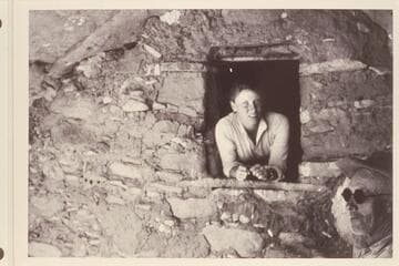 Sarah Fraser in granary. Dave Rust in the shadow at right. The granary is near the Stone-Stanton dredge at Mile 121, Glen Canyon