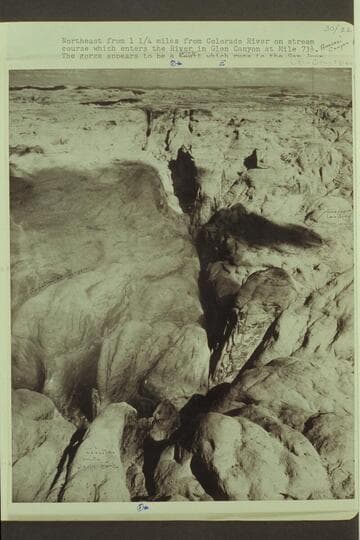 Northeast from 1 1/4 miles from Colorado River on stream course which enters the river in Glen Canyon at Mile 73 1/2 (Anasazi Canyon)