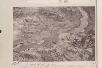Rapid at Mile 184. The 184 mile point is halfway down rapid. This rapid is Chenoweth-Hoyt #43. The island is 0.2 miles down stream and the rapid at the lower end of the island is #44. The river passes from the photo at left at Mile 183.6