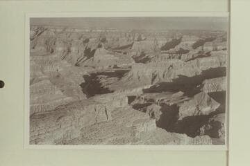 Down the Grand Canyon from Hopi Point.  The butte at lower left is The Alligator and at middle left is Cope Butte.  Between the two is Monument Creek.  Hermit Rapid is in the shadow where the river appears