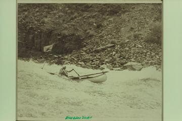The canoe in Dubendorff Rapid. Designed by Ron Smith, Glade Ross, Dee Halladay, and Dean Waterman. Three units were built. The first one probably built in 1965. Dana Burden took this unit through the Grand Canyon in 1969