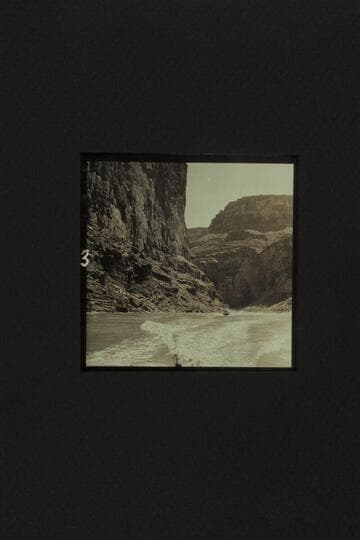 Cruising between President Harding Rapid and Nancoweap, Marble Canyon.  The boat is the "Rattlesnake" with Rod Sanderson piloting and Joe Desloge and Hugh Cutler riding as passengers