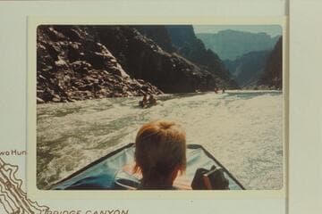 Outboard powered Zodiac craft climbing Bridge Canyon Rapid