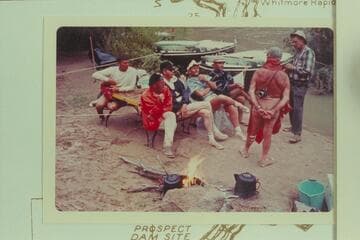 The crew of the Bureau of Reclamation cruise at breakfast after the rain during the night. Foot of the Whitmore Trail, Mile 188.3. Left to right: Buzz Belknap, Jordan, Valentine, Bechtel, Komie, Marston and Borland