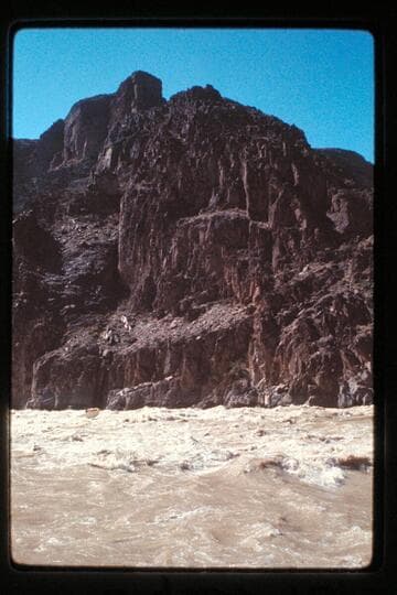 "Wee Red" climbs Monument Creek Rapids