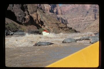 "Wee Red" climbs Vulcan Rapids