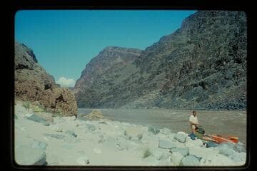 John Evans and yak beached at Travertine Creek