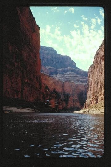 Chopper at dam site, cable tunnel dump, down river