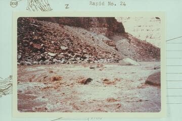 Jean and Hal Bennett in kayak near head of Rapid 22 in The Big Drop.  10,430 cfs