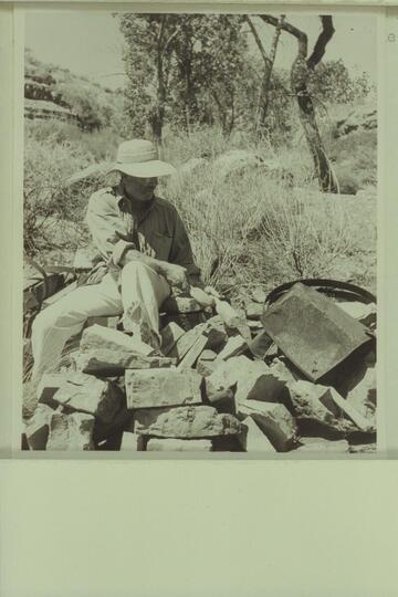 Marston examines the remnants of the old still in Lava Creek Canyon about two miles from the river