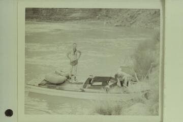Marston and Ed Hudson make preparations for third day of cruise on the "Esmeralda"; foot of Tanner Trail