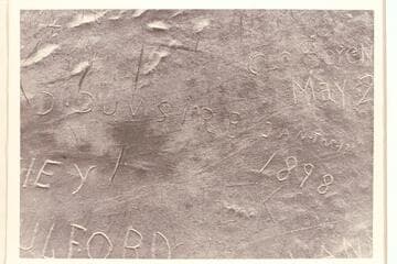 Inscription on huge rock in high cave west of Schock Trail, near Mile 111, north bank