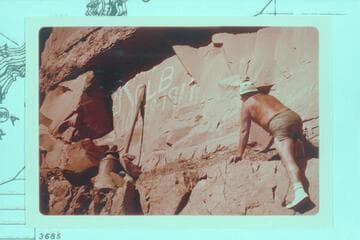 Bill Belknap climbs to the Kolb inscription at Mile 202.25, right bank. The inscription was painted by Emery Kolb 1911, Oct. 28