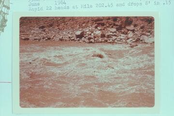 Lower end of Rapid 22 at Mile 203.30. Rapid 22 heads at Mile 202.45 and drops 8 ft. in .15 miles