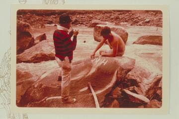Buzz Belknap points up the H Mc inscription for Dock Marston's photography. JsBest's name is at right. Mile 204 1/2 right bank