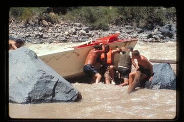 "Wee Red" on rocks; Vulcan Rapids