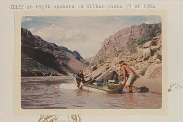 Buzz helping John Evans after capsize below Fall Canyon. Cliff at right appears in Wilbur photo #9 of 1904