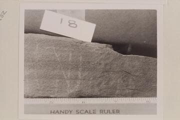 Light scratches on #8 rock taken from the Fort at the mouth of White Canyon. #18 may read "Julian"