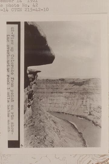 Up Cataract Canyon from approximately Mile 215 1/2. View up Colorado from point on rim showing overhanging rock 1 mile below mouth