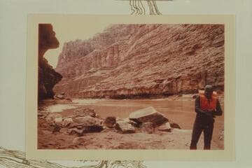 Down river from the beach at the D. Julien inscription, Mile 185.75.  Bill Belknap adjusts his gloves at right