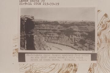 Up Cataract Canyon from Mile 215 1/2.  Colorado River Canyon upstream from point on rim 1200' above water, 1 mile below mouth of Green River
