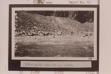 Rapid No. 22 in Cataract Canyon.  Rapid No. 22 heads at Mile 202.45 and drops 8 ft. in .15 miles.  There is disagreement of one day between LaRue's journal and the date on Lint's film