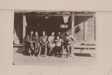 Nequoia Arch Survey; Black Mesa Traverse. Winter of 1927. The gang at Robbers Roost Headquarters. Harold (?) Ekker, Hazel Biddlecome, Arthur Ekker, Millie Biddlecome (with whose baby?), H. Prommel, Pearl Biddlecome in center