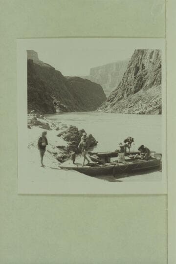 Preparing the camera boat for leaving Separation Canyon.  Dock Marston on the beach; Roy Klinger steps ashore; Gordon Avil, Dick Kelly and Vee Bodrero in the boat